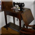 C01. Antique Singer sewing machine and table. 